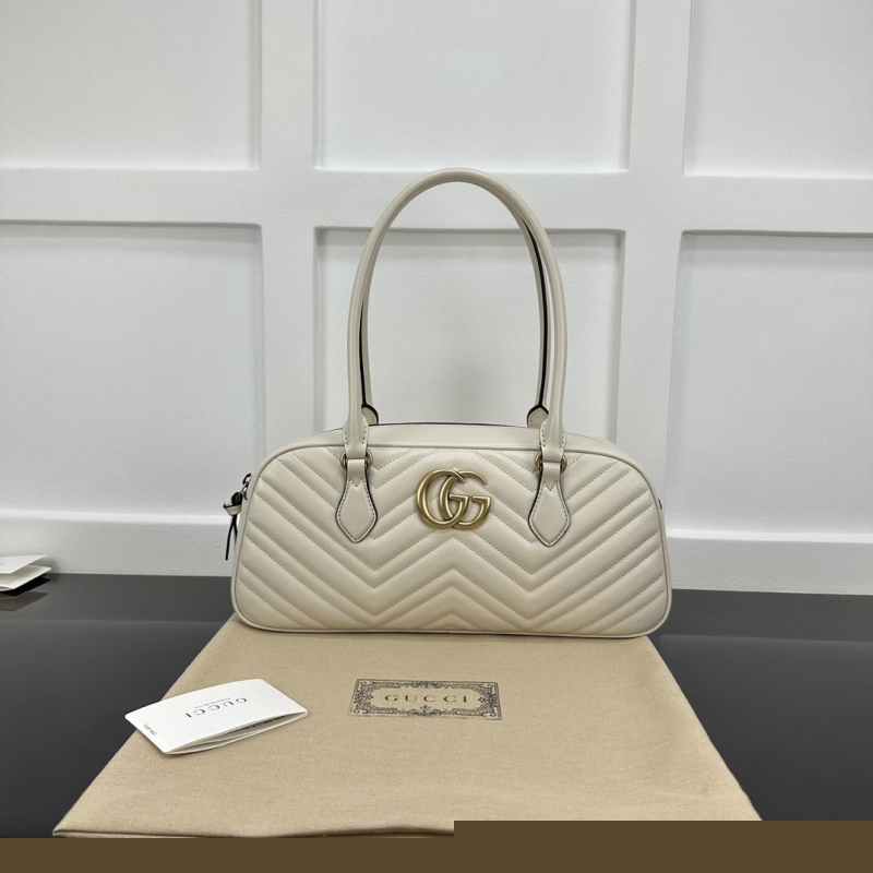 G*u*i top handle bags